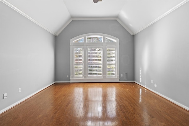 unfurnished room featuring ornamental molding, hardwood / wood-style flooring, and lofted ceiling