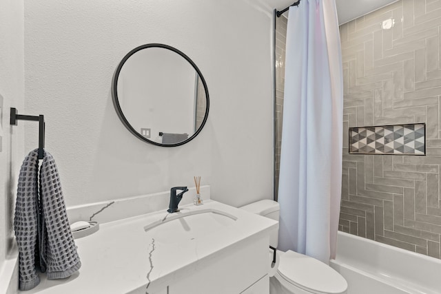 full bathroom with vanity, shower / bath combination with curtain, and toilet