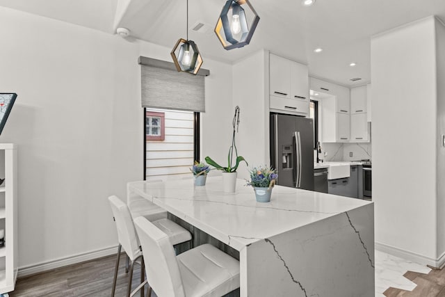 dining space with light hardwood / wood-style floors