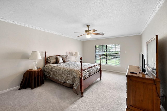 carpeted bedroom with ceiling fan, crown molding, and a textured ceiling