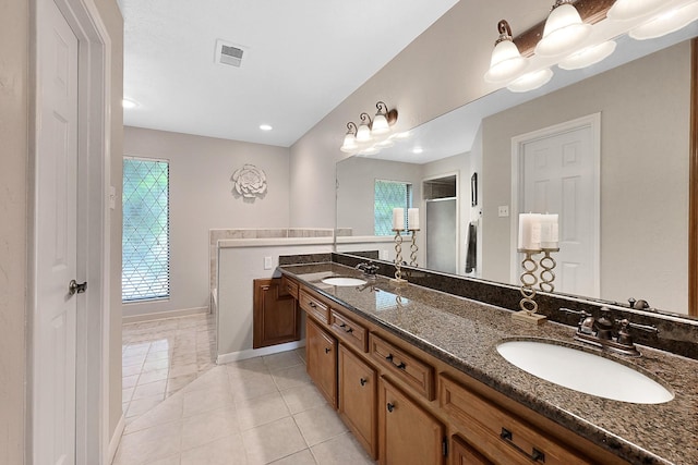 bathroom featuring vanity, tile patterned floors, and separate shower and tub