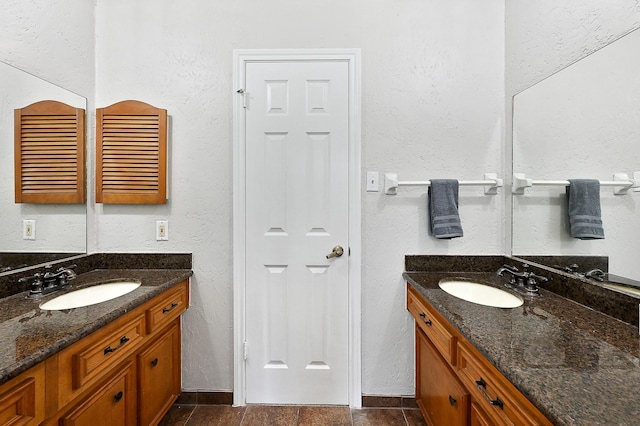 bathroom featuring tile patterned floors and vanity