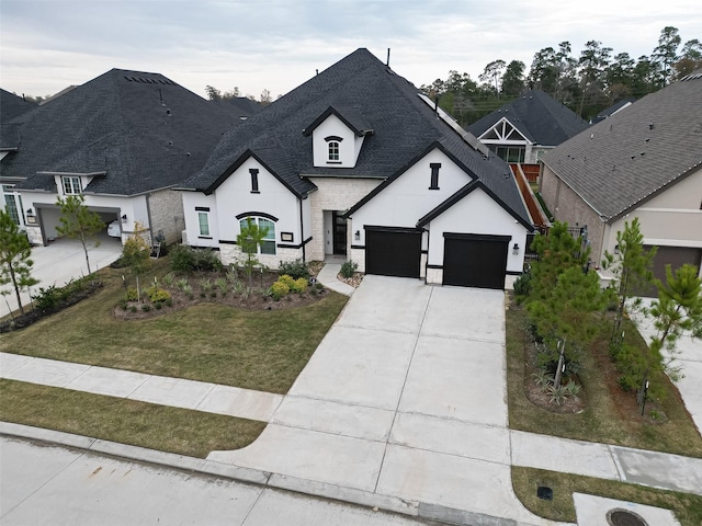 28212 Cedar Peak Dr, Spring, TX 77386 - french country home featuring stone siding, stucco siding, roof with shingles, concrete driveway, and a front lawn