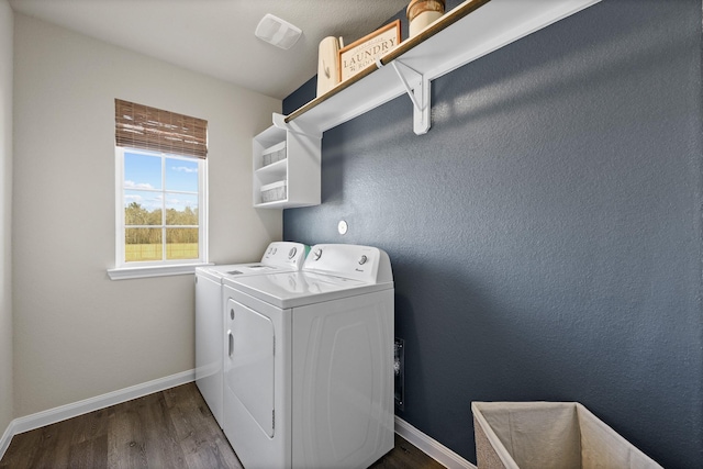 laundry room with washing machine and dryer and dark hardwood / wood-style flooring