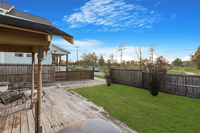 view of yard featuring a wooden deck