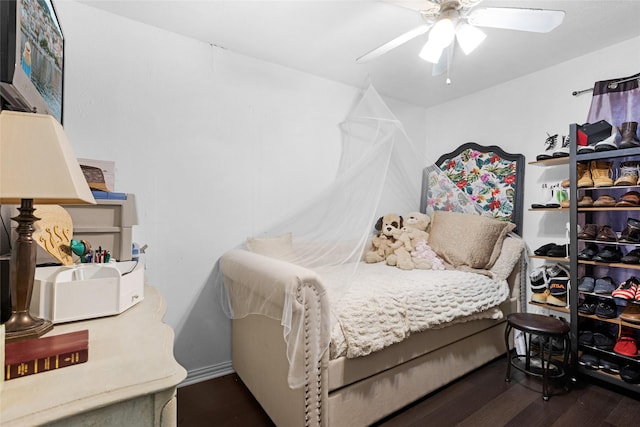 bedroom featuring dark hardwood / wood-style floors and ceiling fan