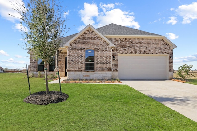 view of front of house with a garage and a front lawn