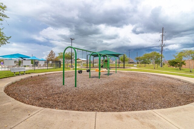 view of playground with a yard