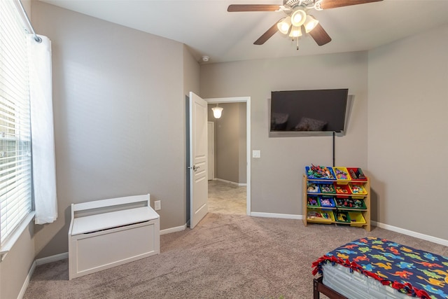 carpeted bedroom with ceiling fan