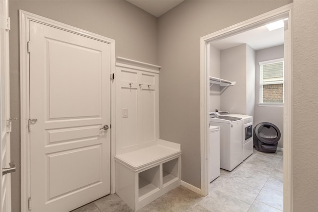 laundry area with separate washer and dryer