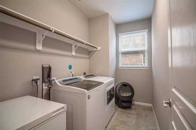 laundry area with washing machine and dryer