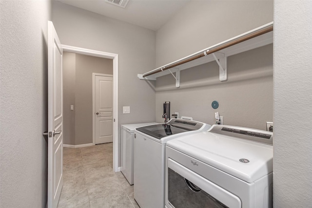 clothes washing area featuring washing machine and dryer