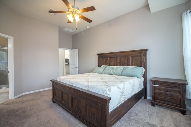 carpeted bedroom with connected bathroom, ceiling fan, and lofted ceiling