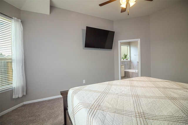 carpeted bedroom with ceiling fan and ensuite bathroom