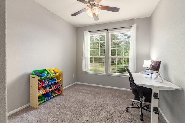 carpeted office featuring ceiling fan