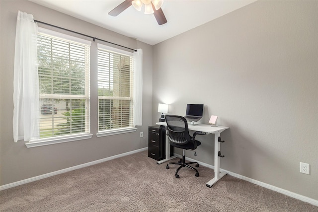 office featuring ceiling fan and light colored carpet