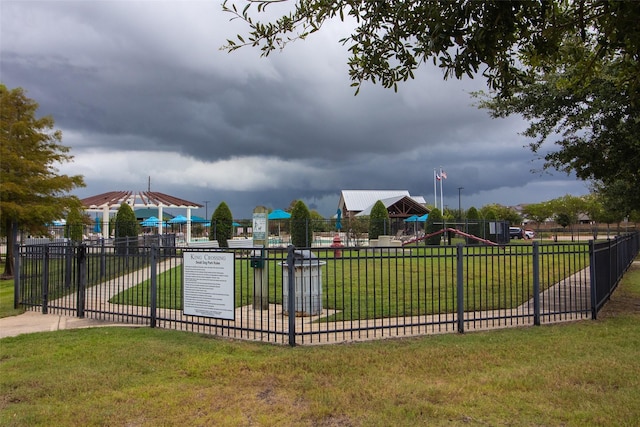 view of jungle gym featuring a lawn