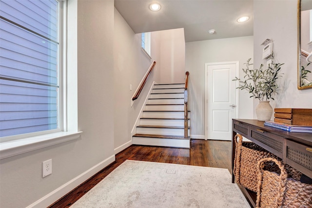 stairs with wood-type flooring