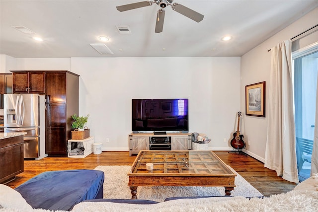 living room with hardwood / wood-style floors and ceiling fan