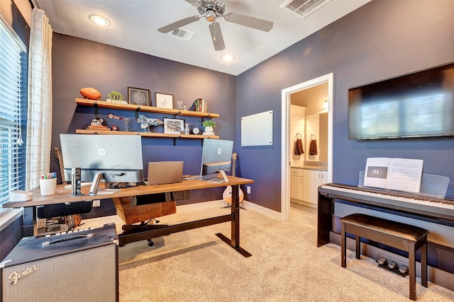 office space with ceiling fan and light colored carpet