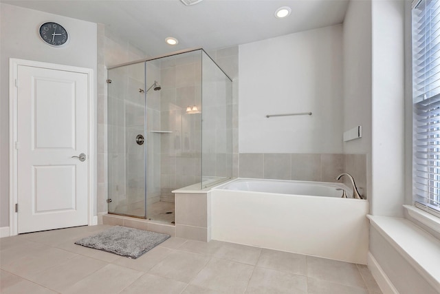 bathroom with tile patterned floors and plus walk in shower