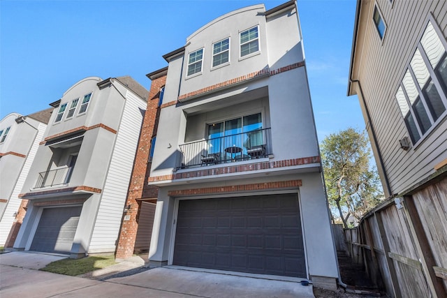 view of front of house featuring a balcony and a garage