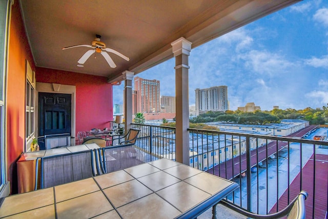 balcony featuring an outdoor hangout area and ceiling fan