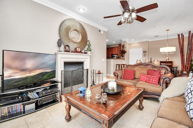 living room featuring crown molding and ceiling fan