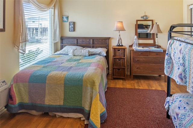 bedroom featuring hardwood / wood-style floors