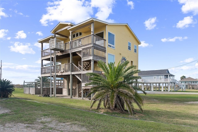 rear view of property with a lawn