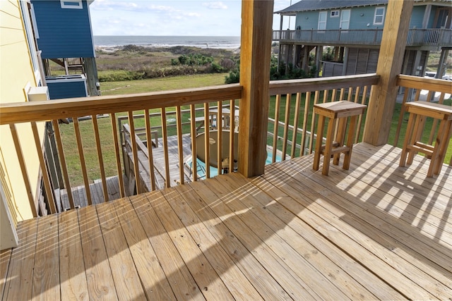 wooden terrace with a water view