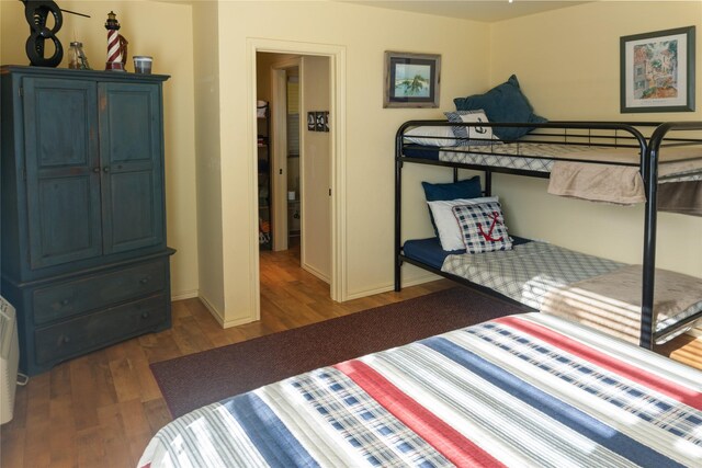 bedroom with a closet and dark wood-type flooring