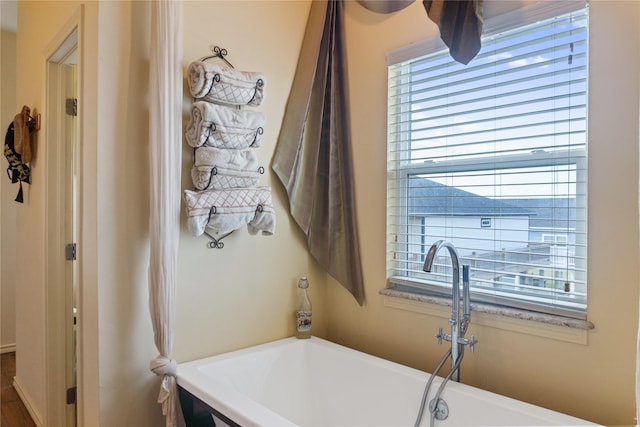 bathroom featuring a tub