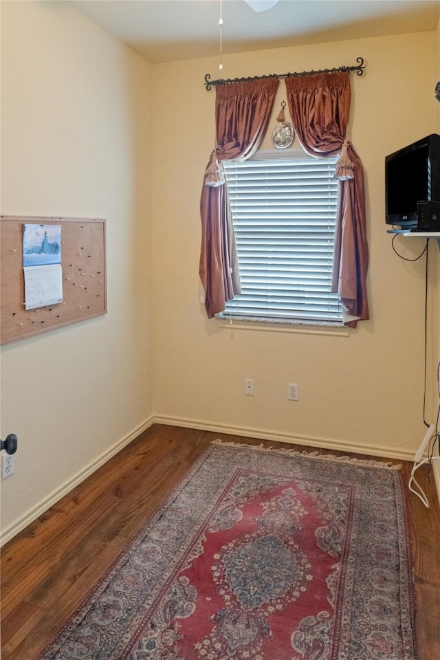 empty room with hardwood / wood-style flooring