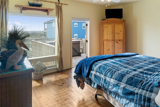 bedroom with ceiling fan and light hardwood / wood-style flooring