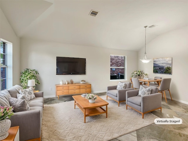 living room featuring vaulted ceiling