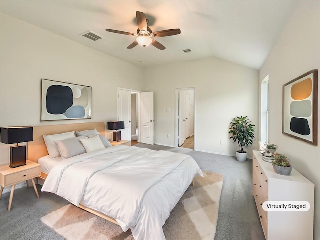 carpeted bedroom featuring vaulted ceiling and ceiling fan