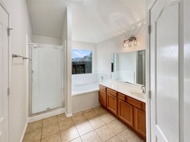 bathroom featuring tile patterned floors, vanity, and separate shower and tub