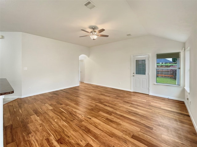 unfurnished living room featuring ceiling fan, hardwood / wood-style floors, and lofted ceiling