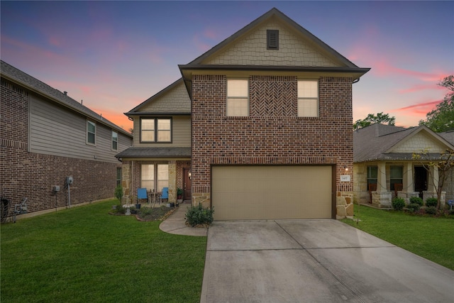 view of front facade with a lawn and a garage