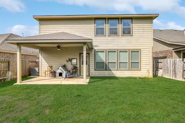 back of house featuring a patio, central AC unit, ceiling fan, and a lawn