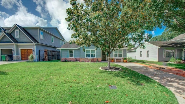 view of front of property with a front yard and a garage