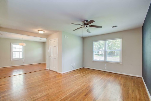 spare room with ceiling fan and light hardwood / wood-style flooring