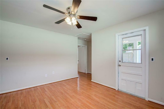 empty room featuring ceiling fan and light hardwood / wood-style floors