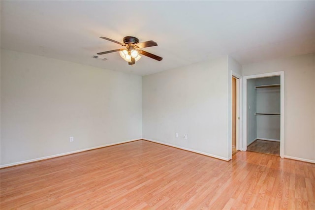 unfurnished bedroom with ceiling fan and light hardwood / wood-style flooring