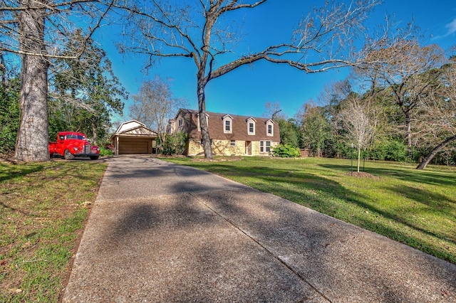 view of front of home featuring a garage and a front yard