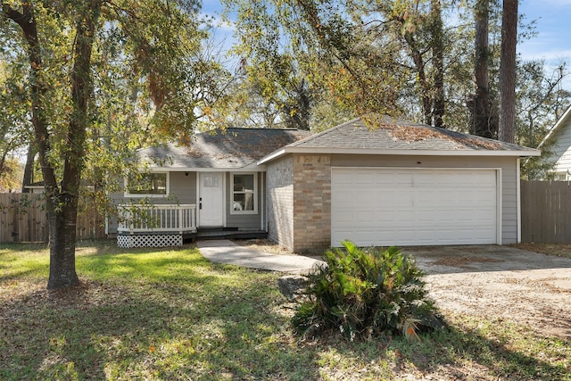 ranch-style home with a garage, a deck, and a front lawn