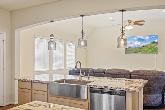 kitchen with vaulted ceiling, ceiling fan, sink, pendant lighting, and dishwasher