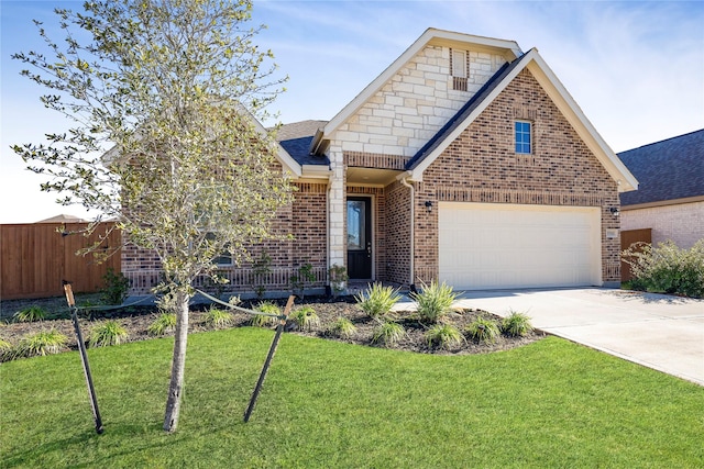 view of front of home featuring a garage and a front lawn