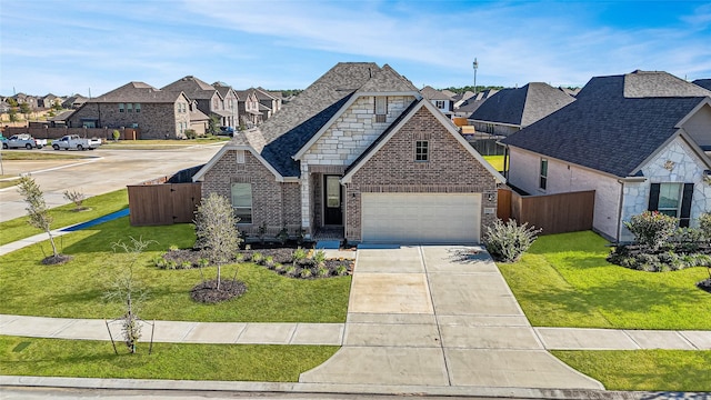 french provincial home with a garage and a front yard